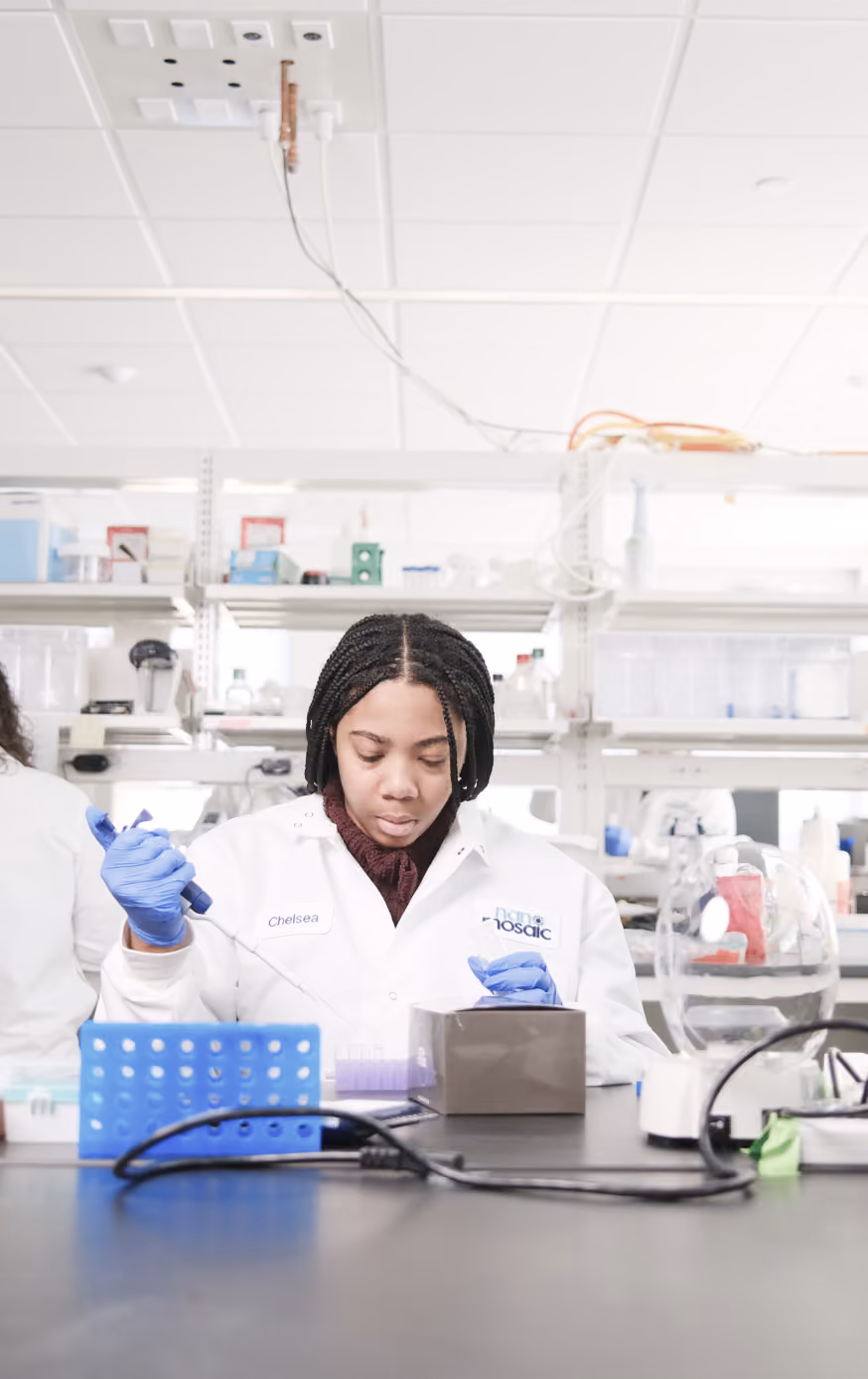 Scientist pipetting samples in the NanoMosaic lab