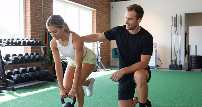 Patient working with a provider at a performance physical therapy clinic in Louisville
