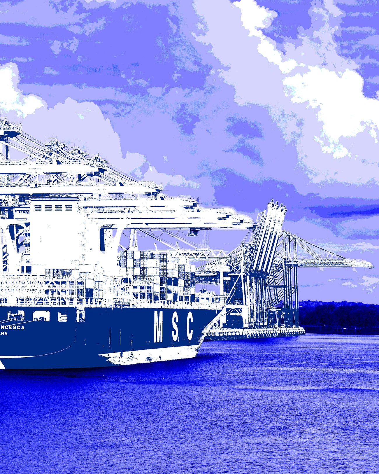 Container ship docked at a busy port terminal.