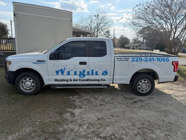 White pickup truck with Wright's Heating & Air Conditioning Co. logo and phone number 229-241-1066 on the side.