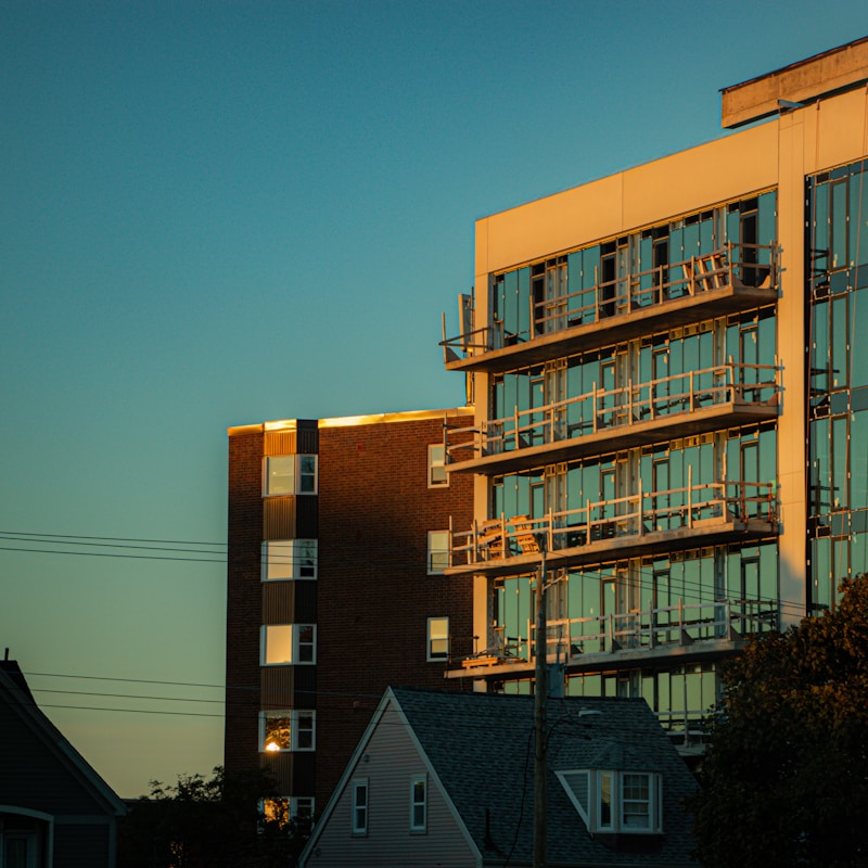 Modern buildings illuminated by warm sunset light