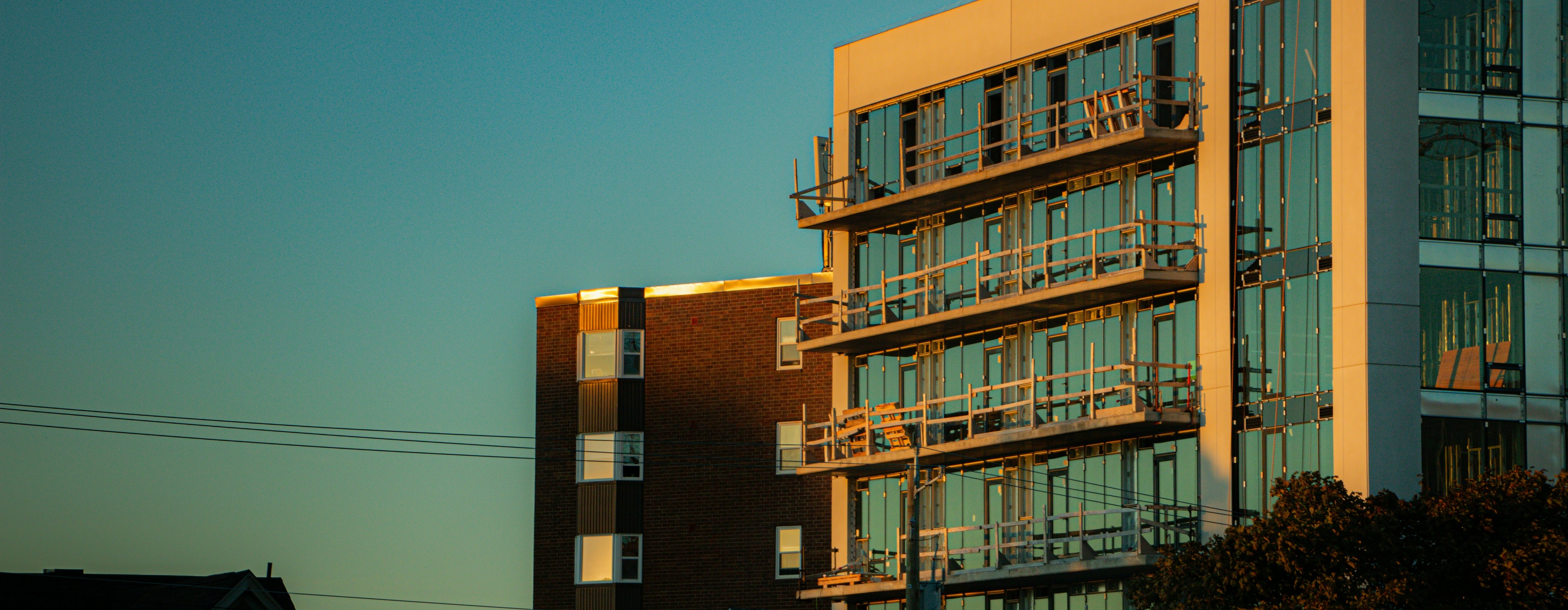 Modern buildings illuminated by warm sunset light