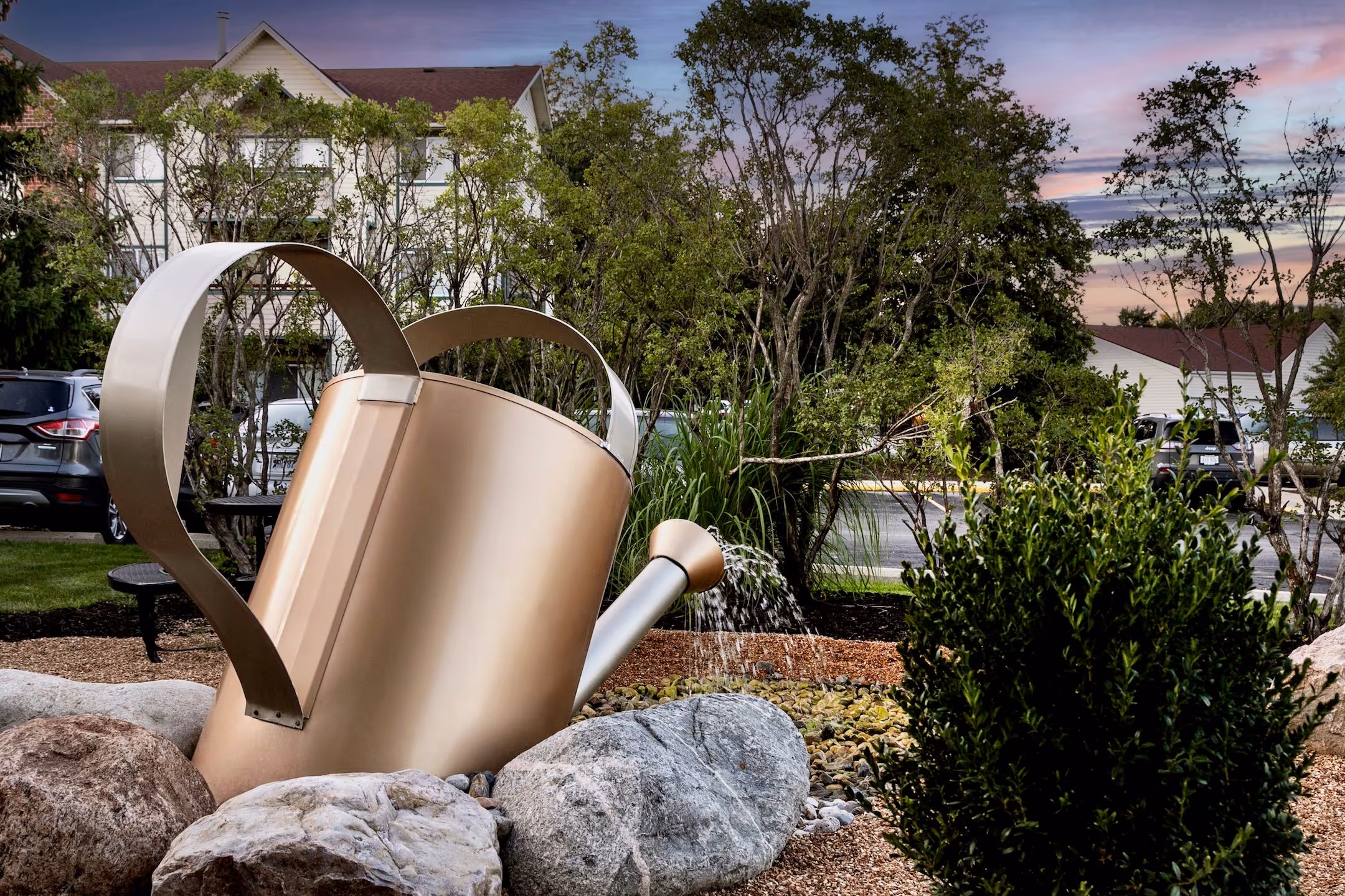 Watering can statue outside