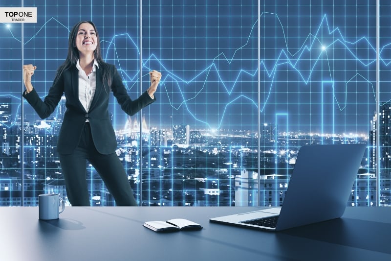 A successful trader celebrates profits—highlighting one possible answer to is prop trading worth it?