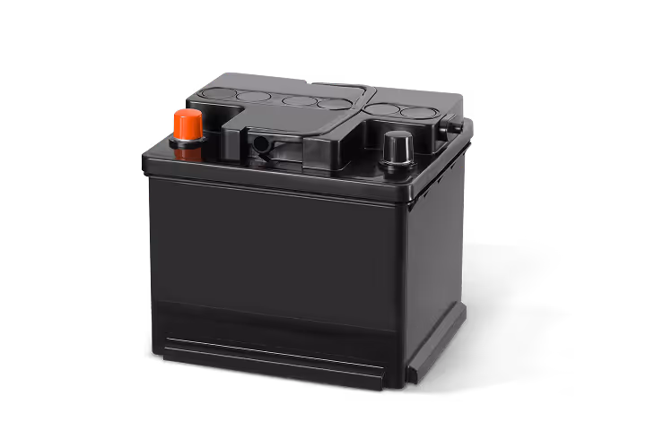 Black automotive battery with red positive and black negative terminals on top.