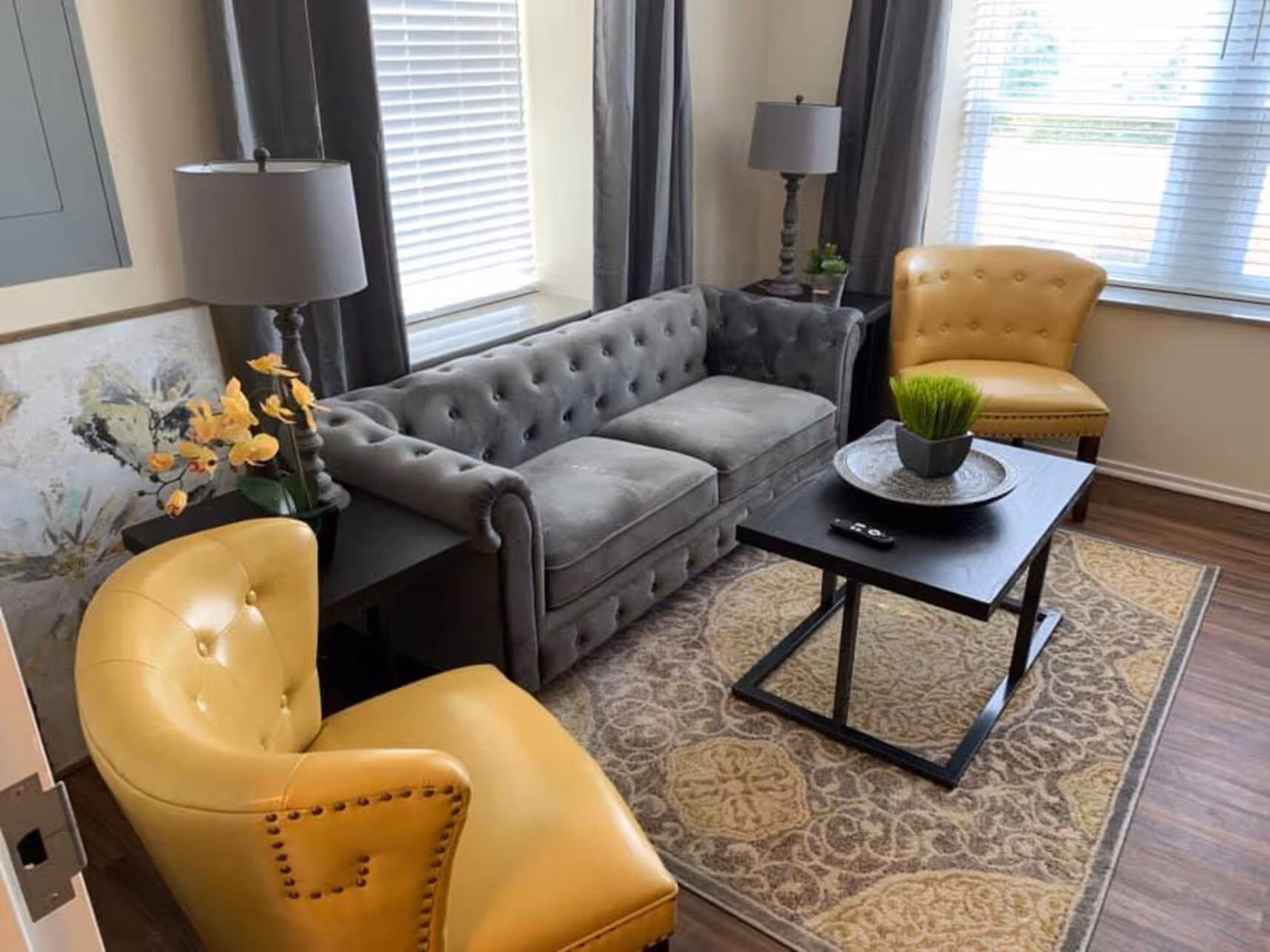 Living area with sofas, chairs, and coffee table