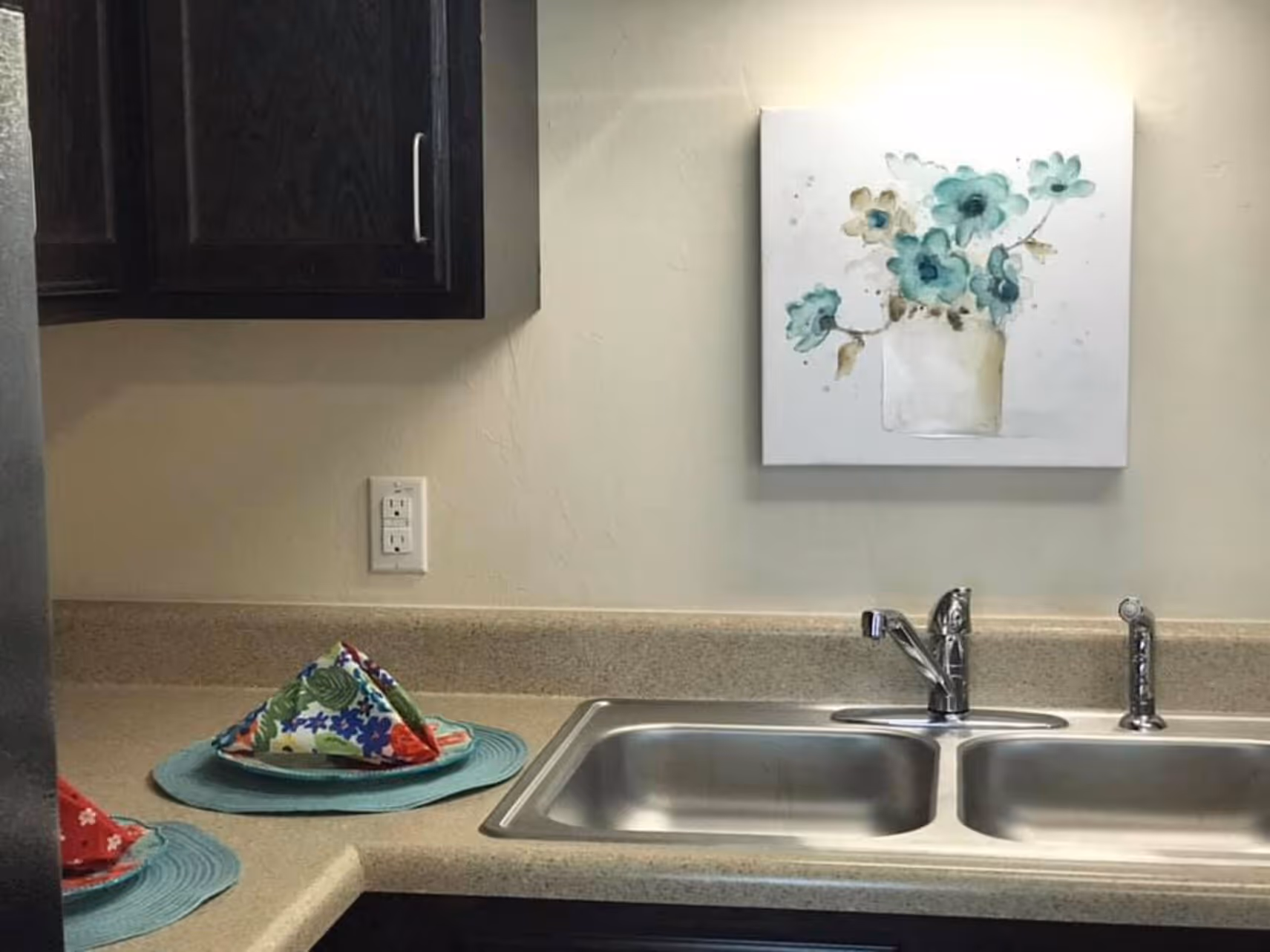 Kitchen with brown cabinets and sink