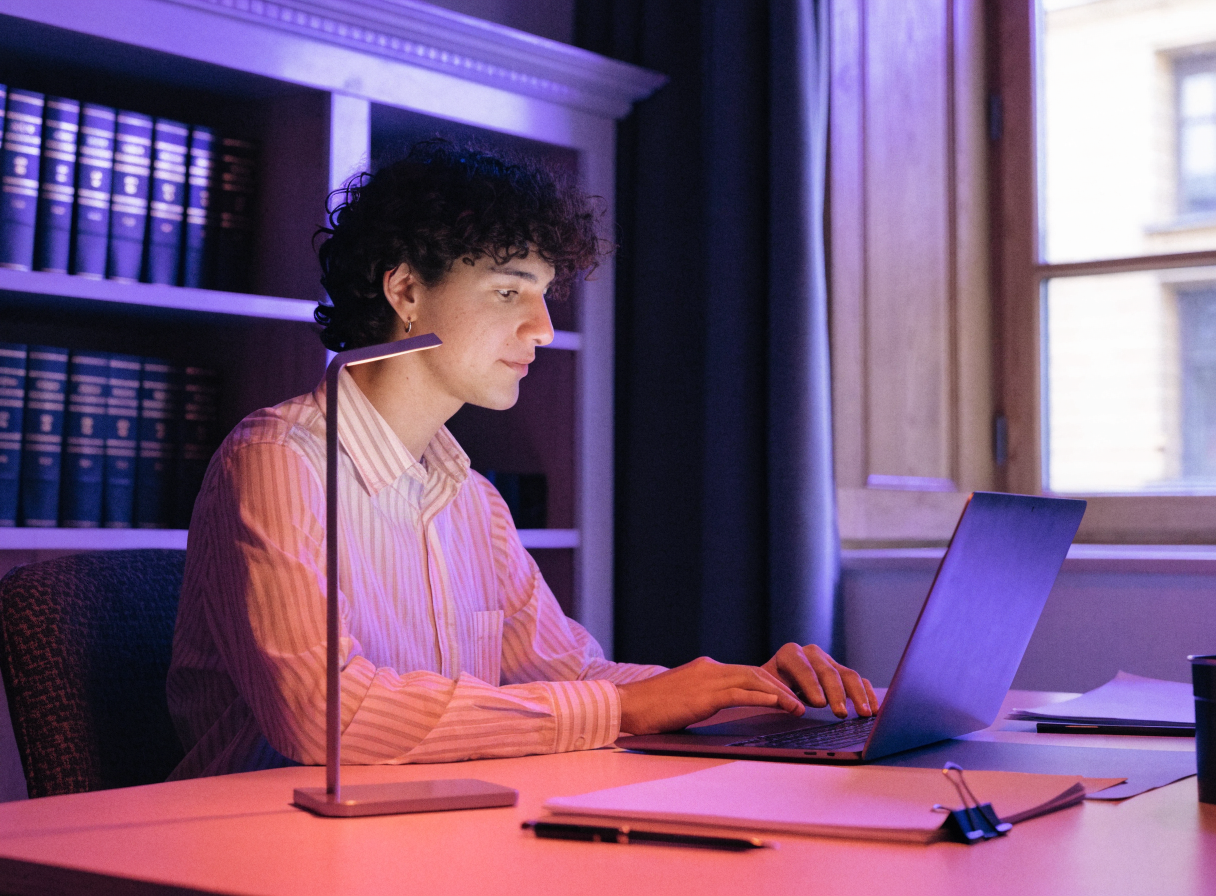 Attorney reviewing an AI assistant on a laptop