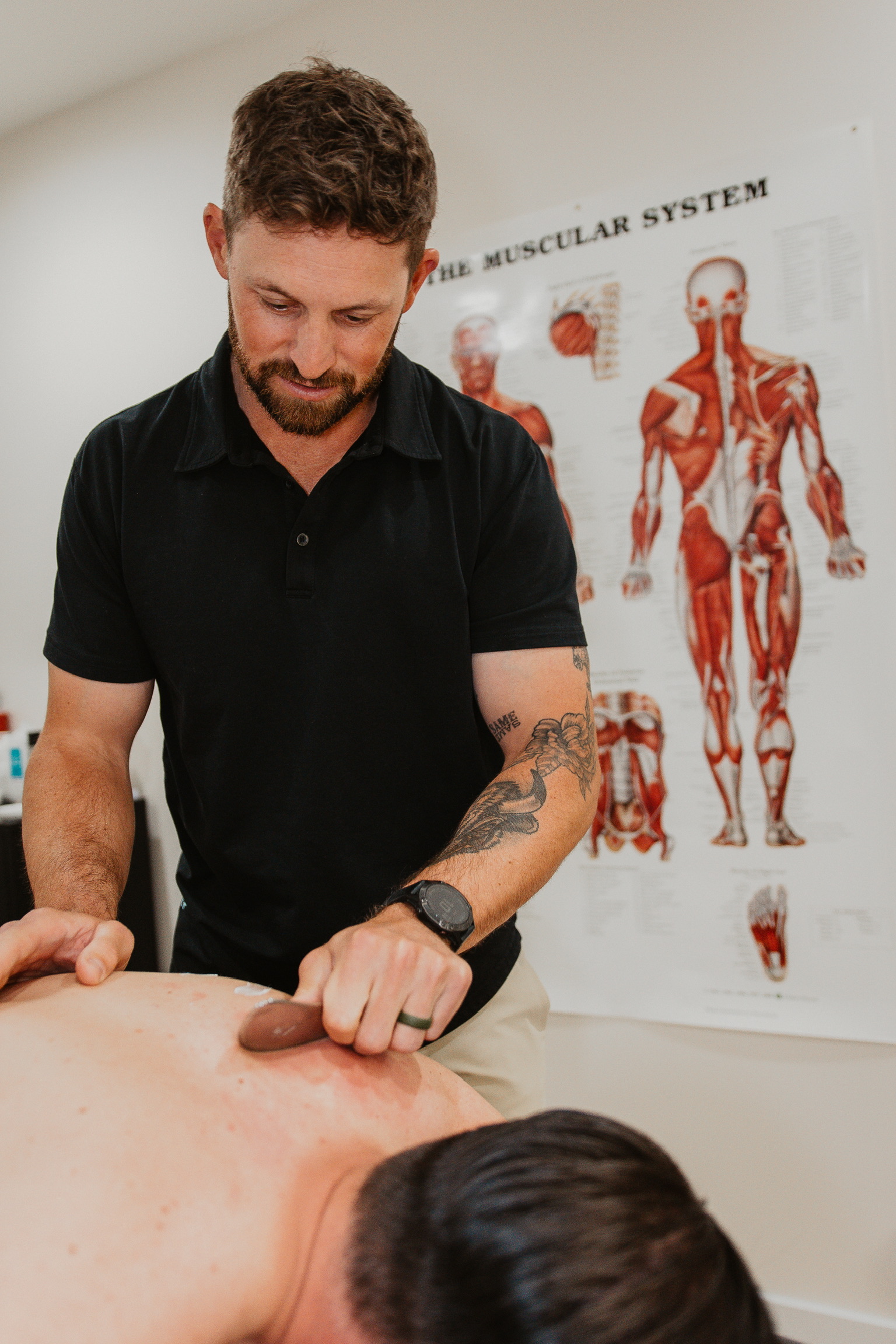 Patient working with a chiropractor at a chiropractic clinic in Greenville