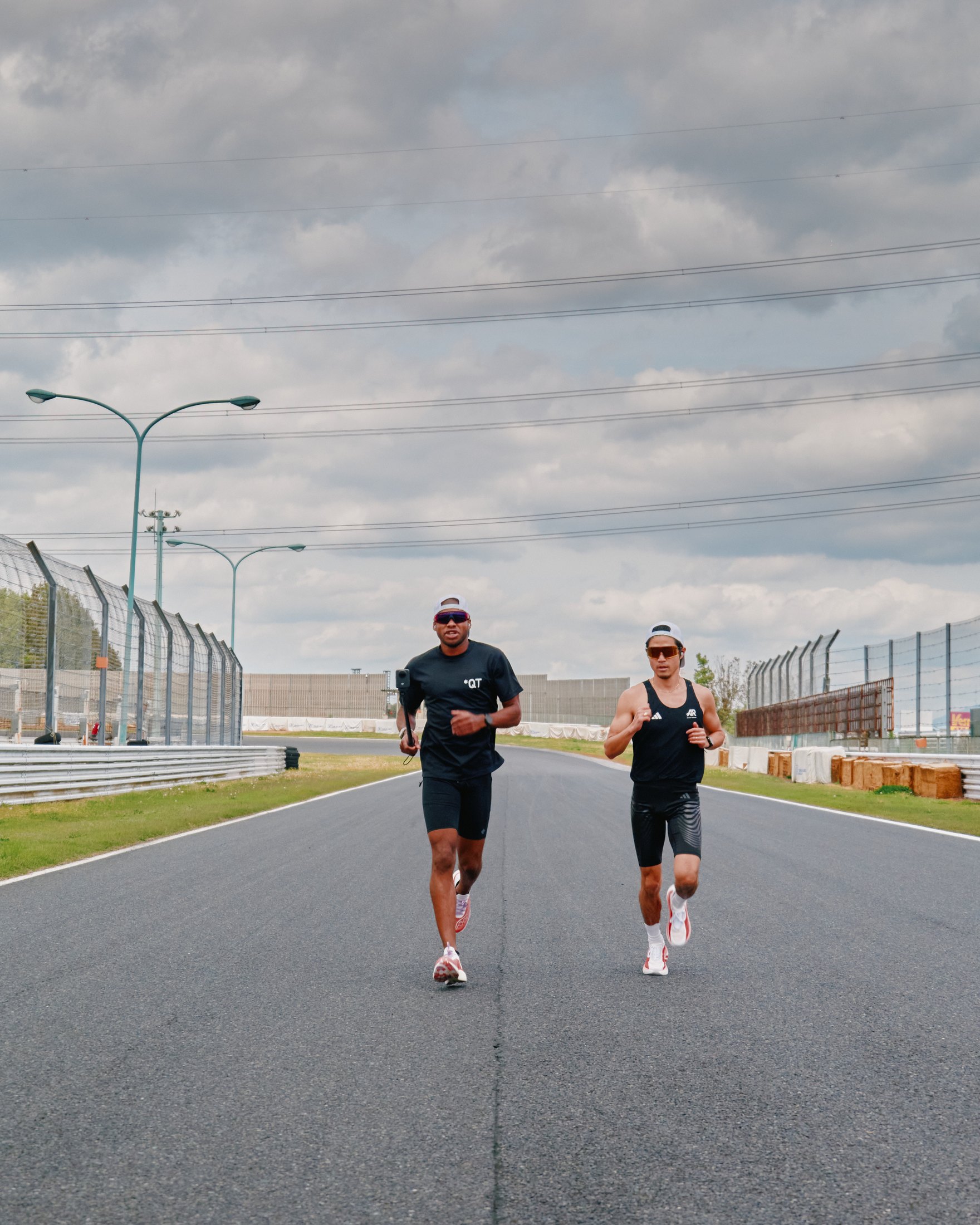 QuHarrison Terry in training kit on a circuit, full frame