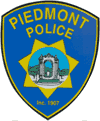 Piedmont Police badge featuring a bridge and the year 1907.