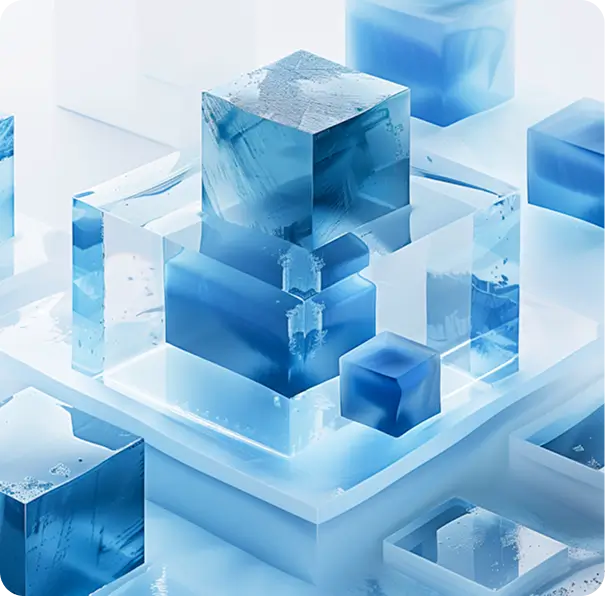 Translucent blue ice cubes, some stacked on top of each other on a white surface.