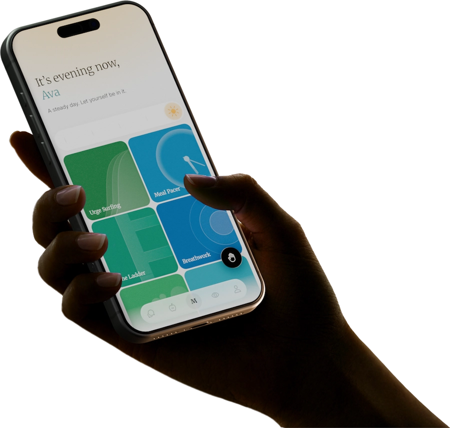 Hand holding a smartphone displaying a wellness app with sections titled Ride the wave, Settle the body, and Build tolerance.
