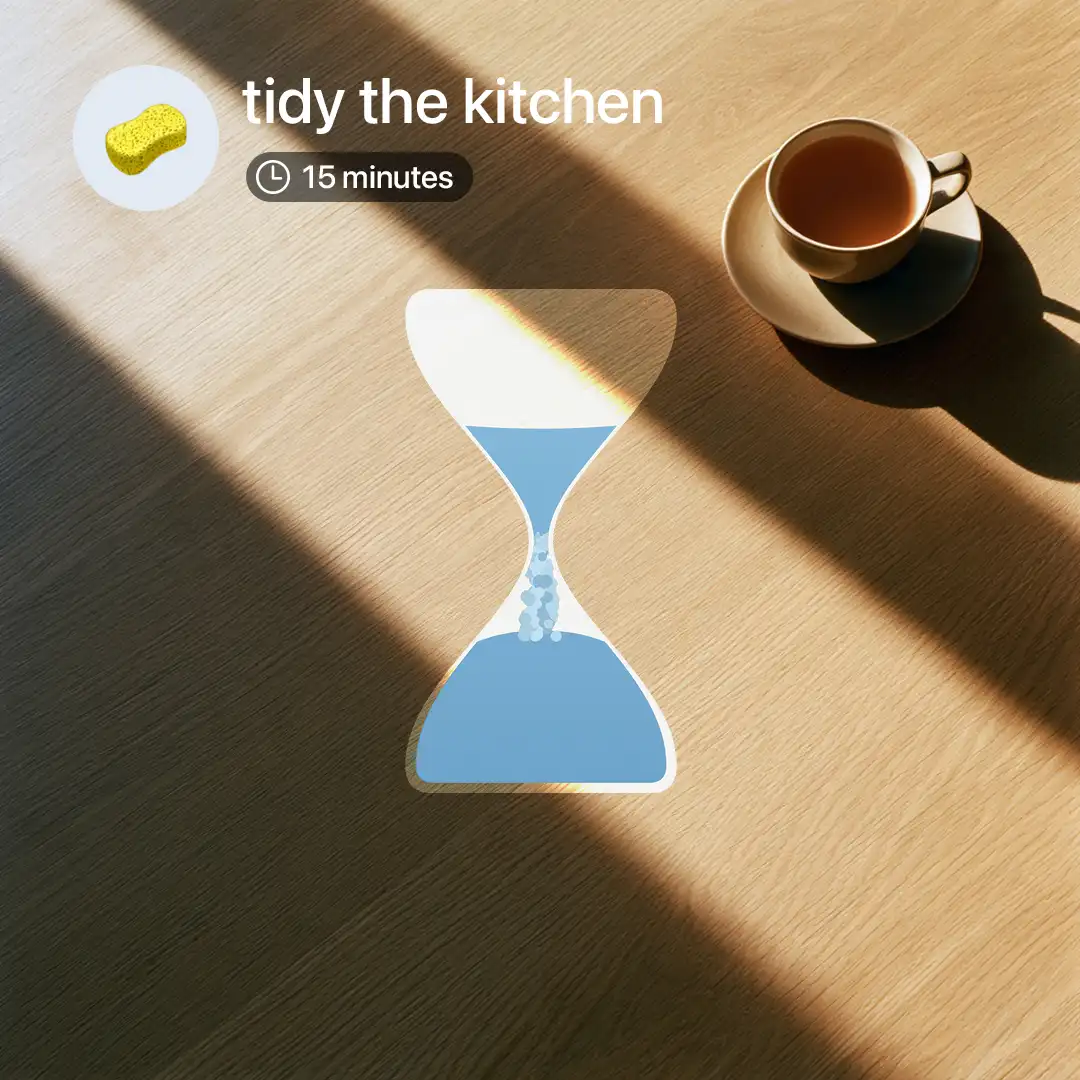 Focus session timer for tidying the kitchen, shown as a blue hourglass on a sunlit wooden table