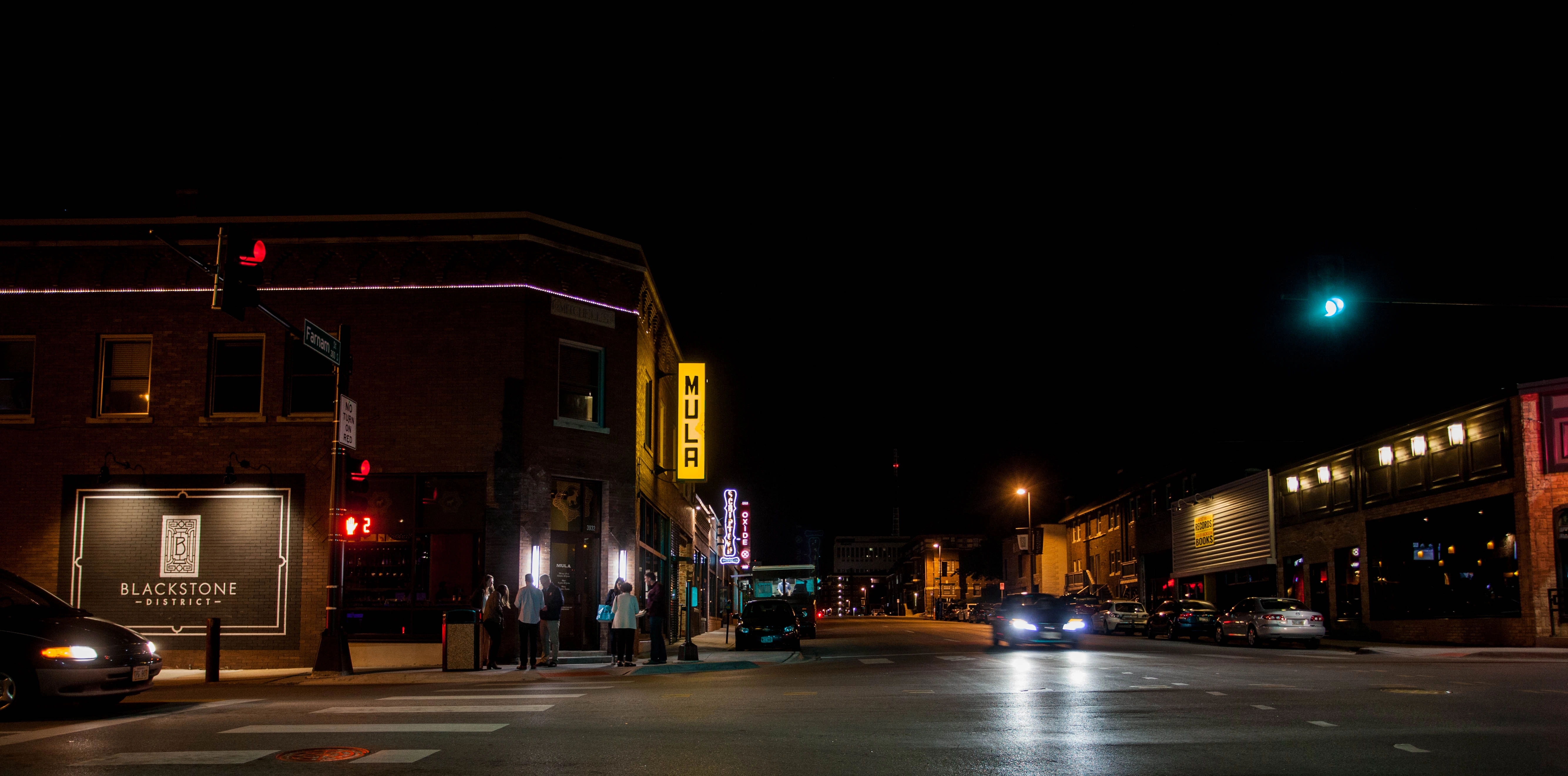 Blackstone District street scene at night with early businesses 2013-2014