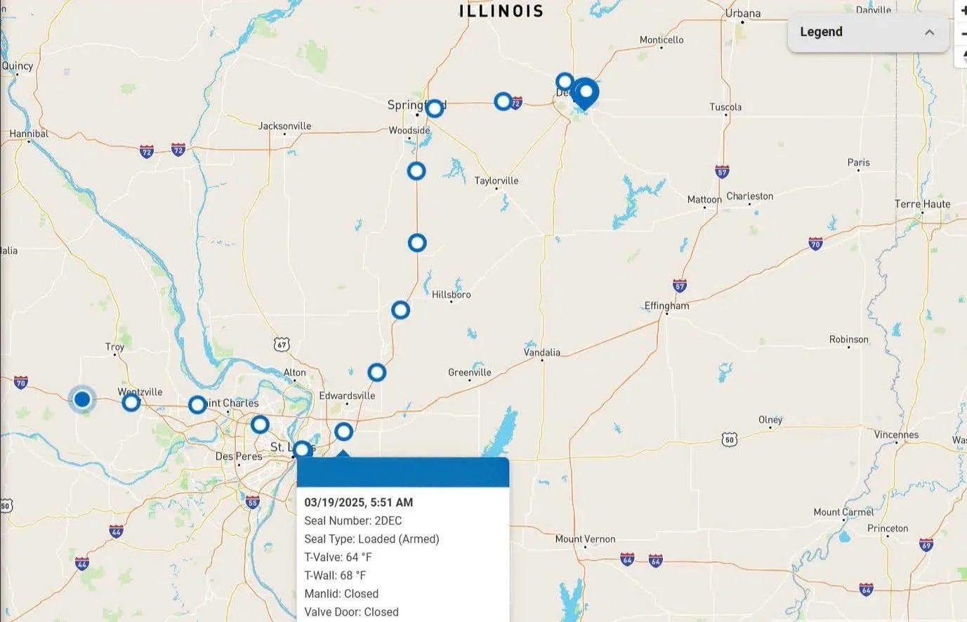Map of Illinois and Missouri with several blue circles marking locations, a pop-up box showing seal details including the date 03/19/2025, seal number 2DEC, seal type loaded (armed), temperatures at valve and wall, and status of manlid and valve door as closed.