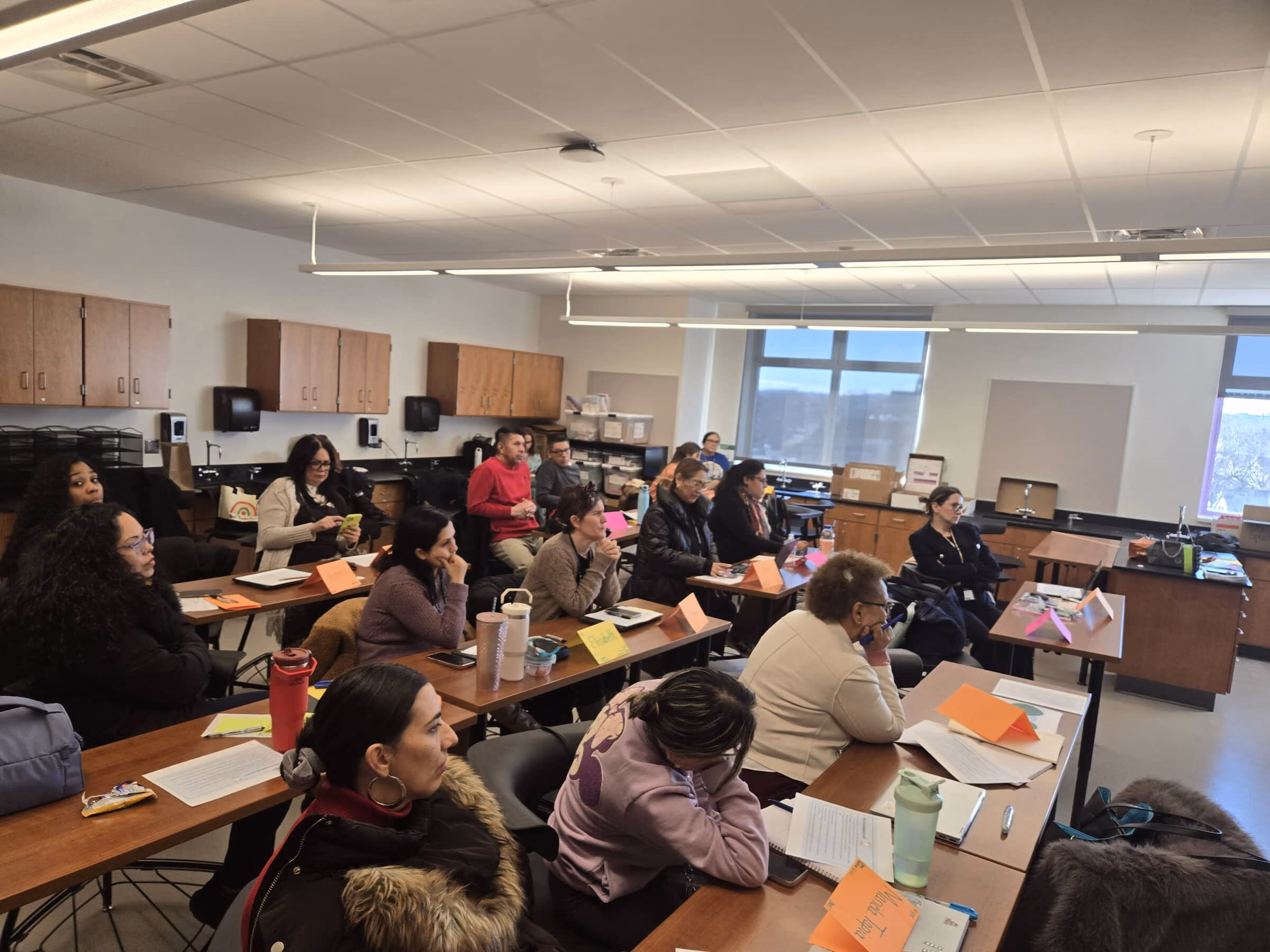 School staff seated at tables during a district professional learning day