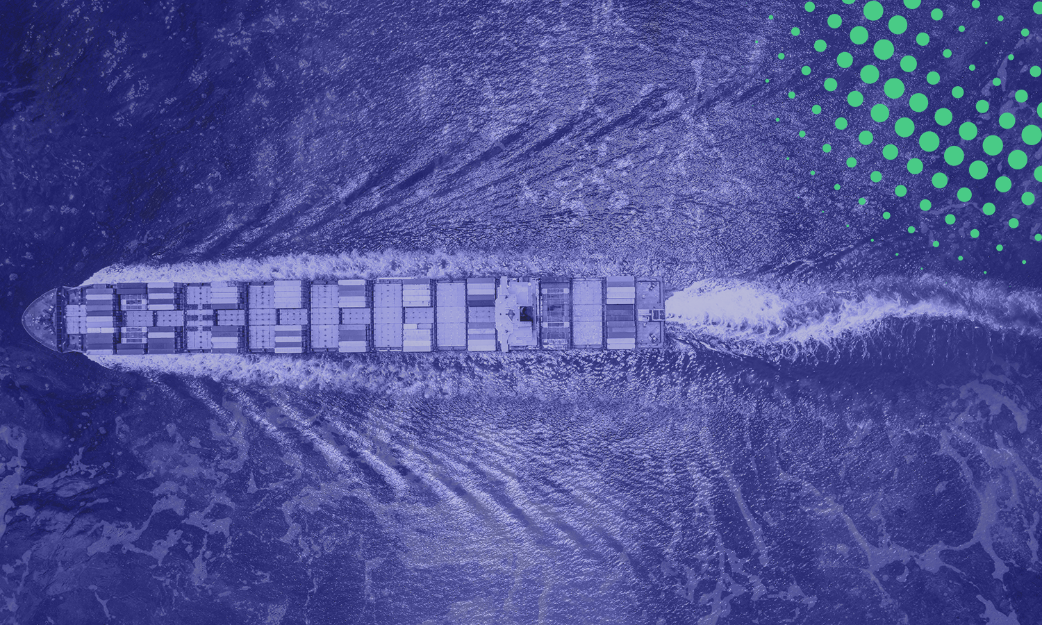 Aerial view of a large cargo ship sailing through rough sea waters.