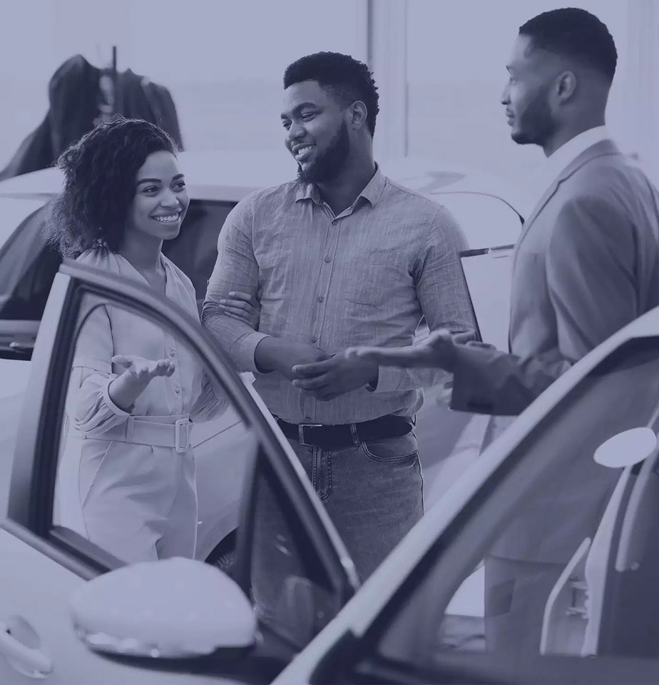 a group of people standing near a vehicle