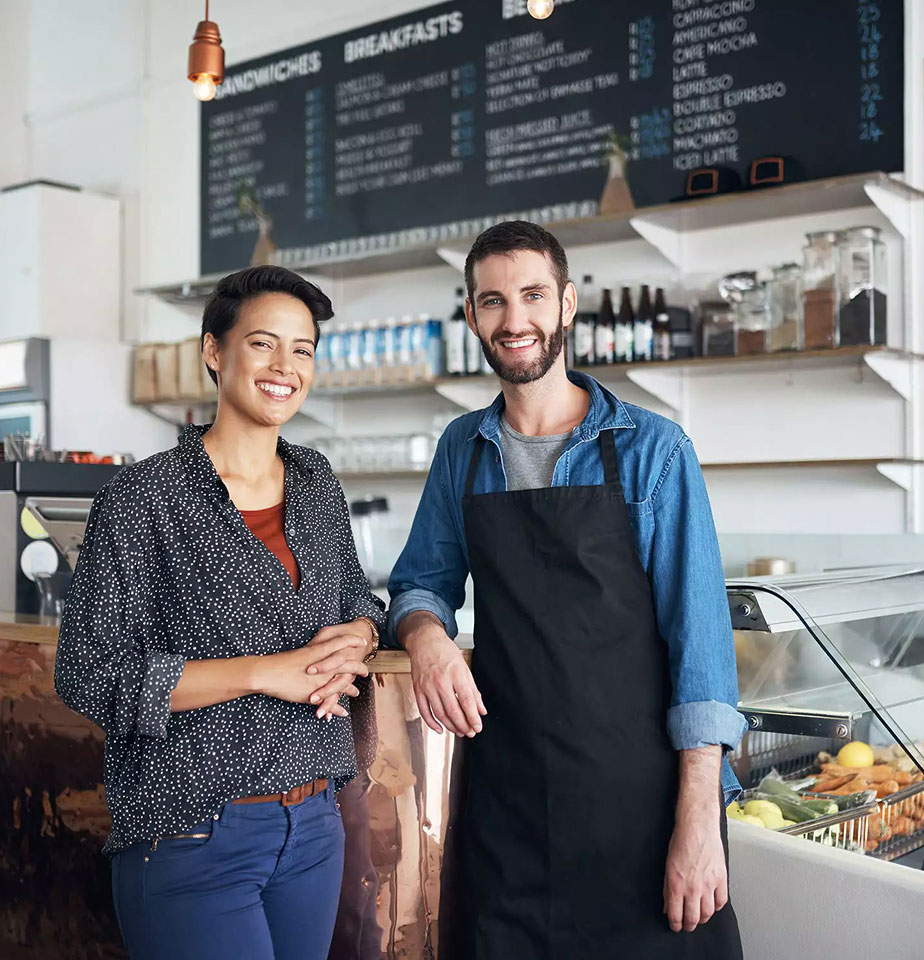man and woman standing in their business space