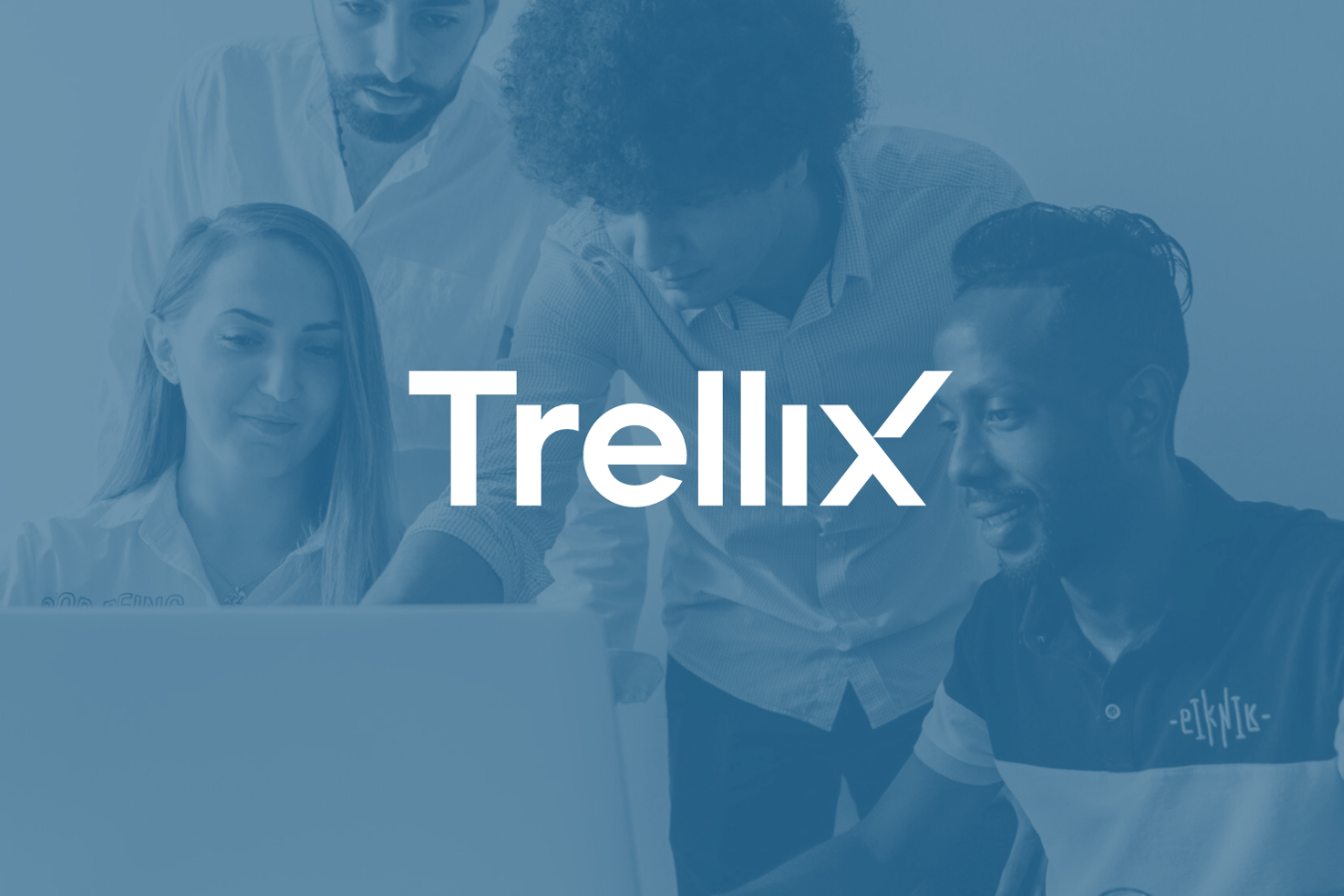 Four people collaborating around a laptop, with the Trellix logo overlaid.