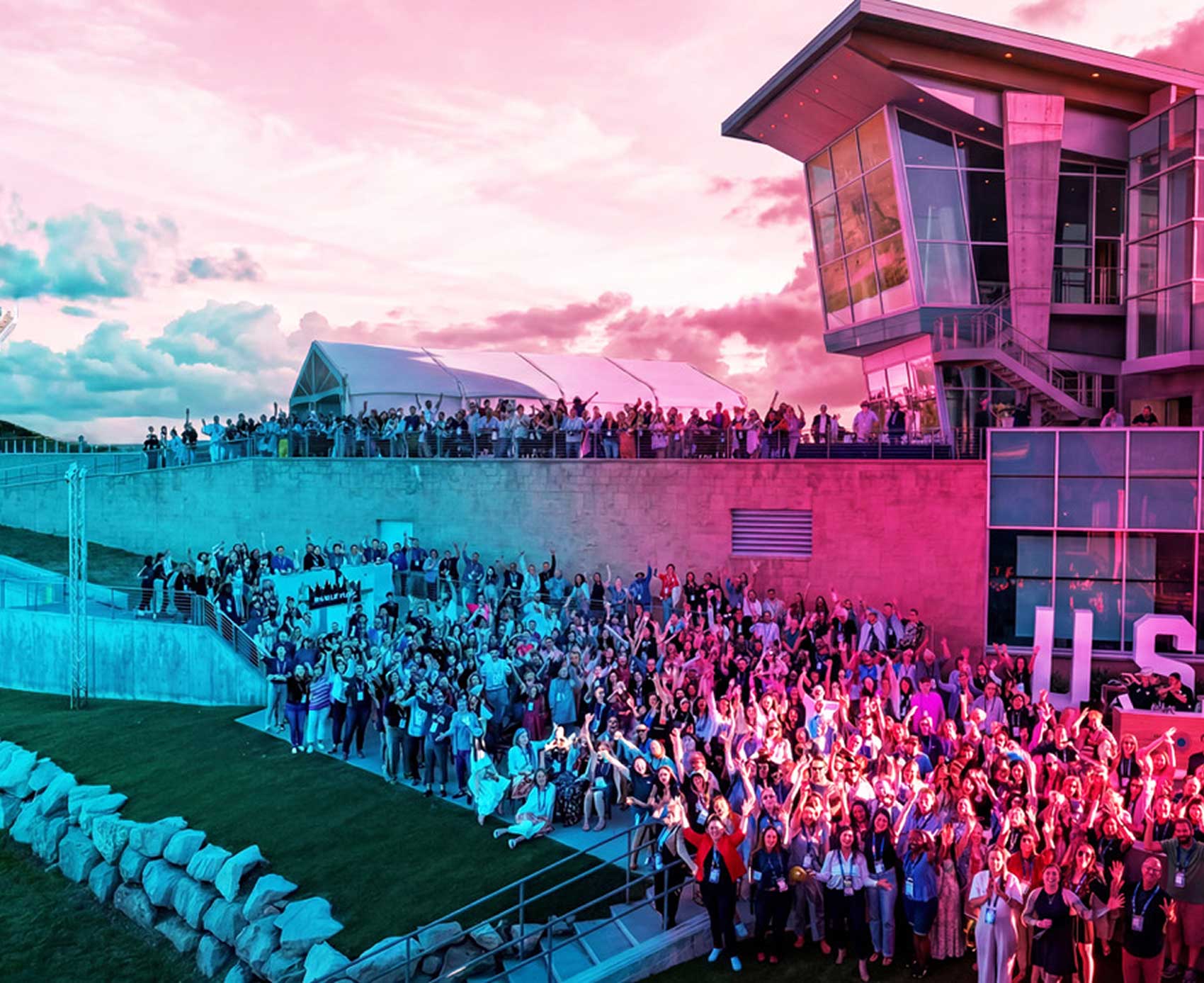 the goodway group team standing outside of their main offices and cheering