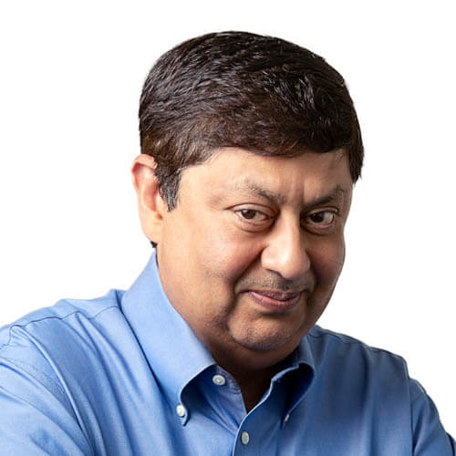 Middle-aged man with dark hair wearing blue shirt, white background