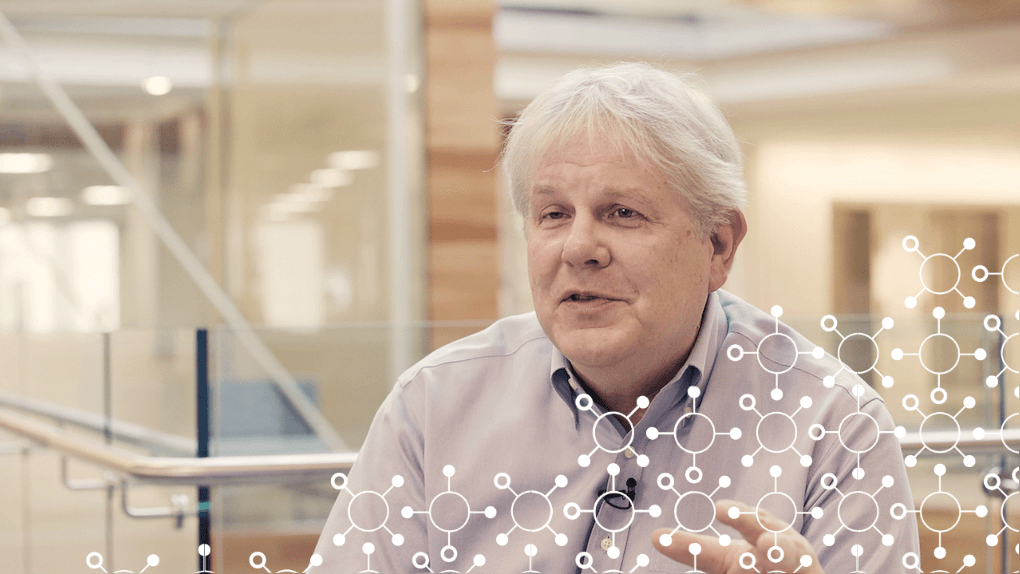 Older man in office with digital network visualization overlay on his chest
