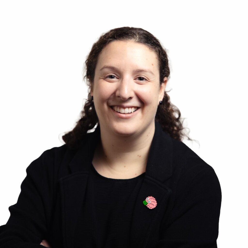Portrait of a smiling woman with long dark braided hair wearing black shirt