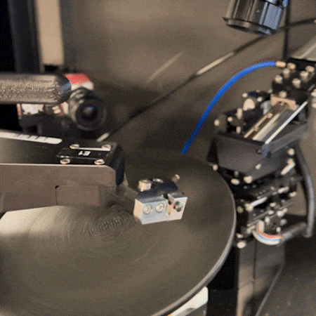 Professional audio equipment setup with turntable, mixer, and microphone