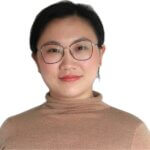 Portrait of a person wearing glasses and a beige turtleneck sweater