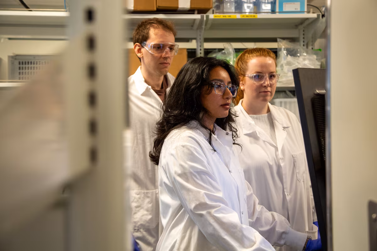 3 scientists in lab viewing results