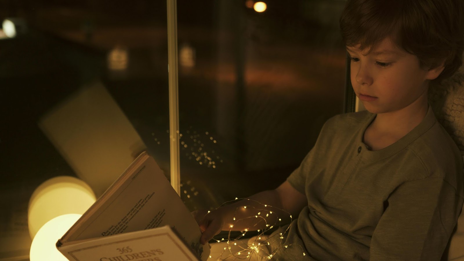 Child reading a book using recipe for reading intervention strategies in a serene setting