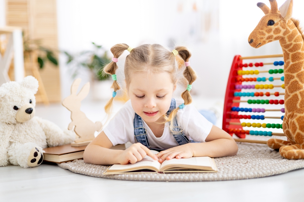 Girl achieving reading fluency goals during Christmas