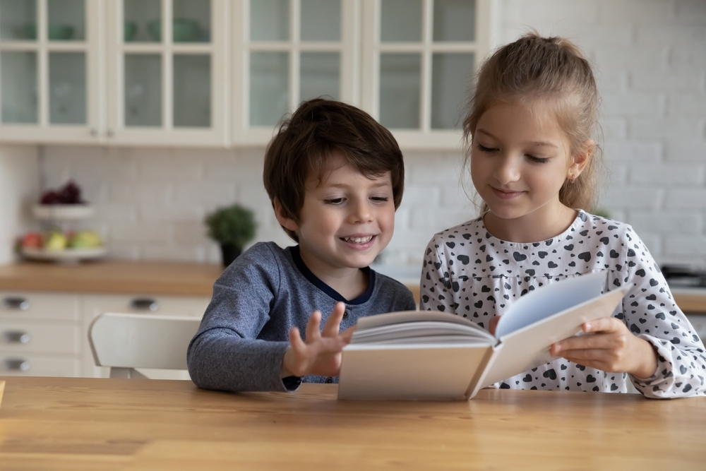 Kids reading a book as part of a school reading program