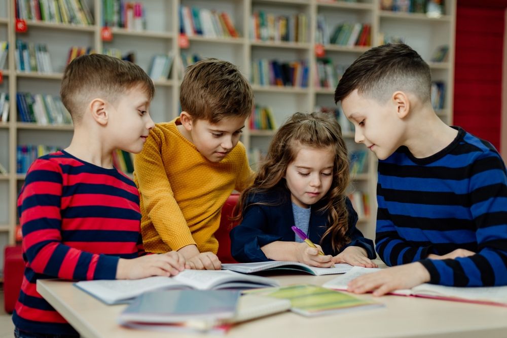 A confident child enjoying independent reading thanks to a reading intervention program.