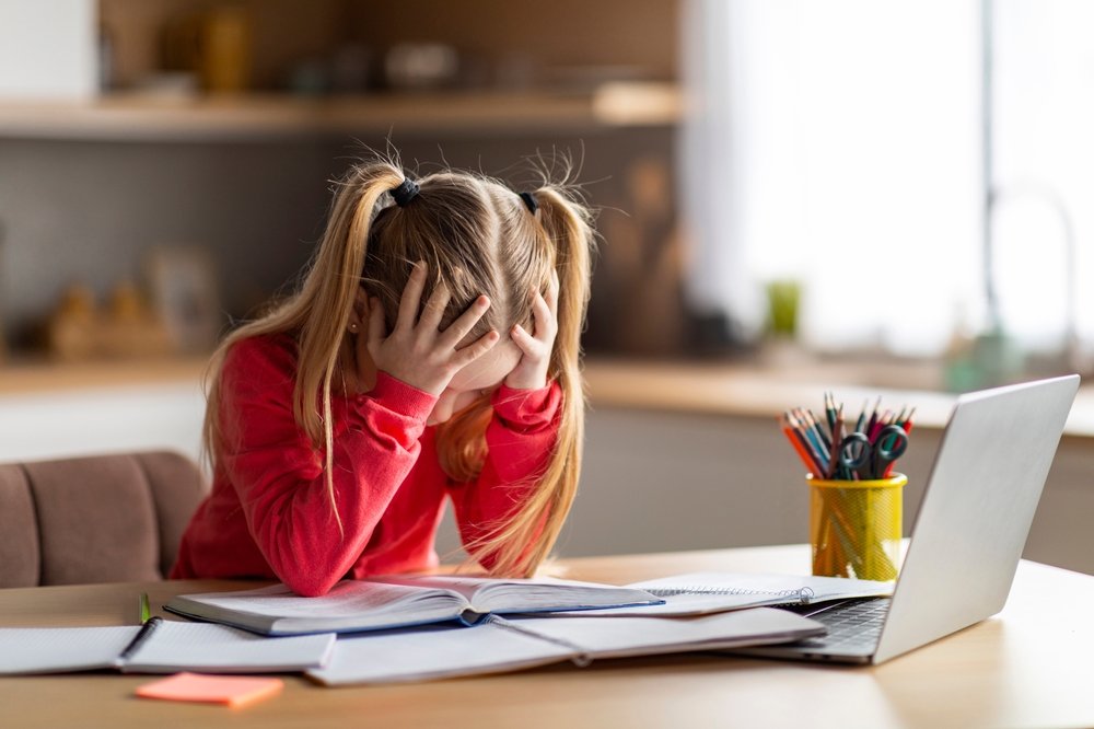 Girl struggling with studies showing illiteracy in California