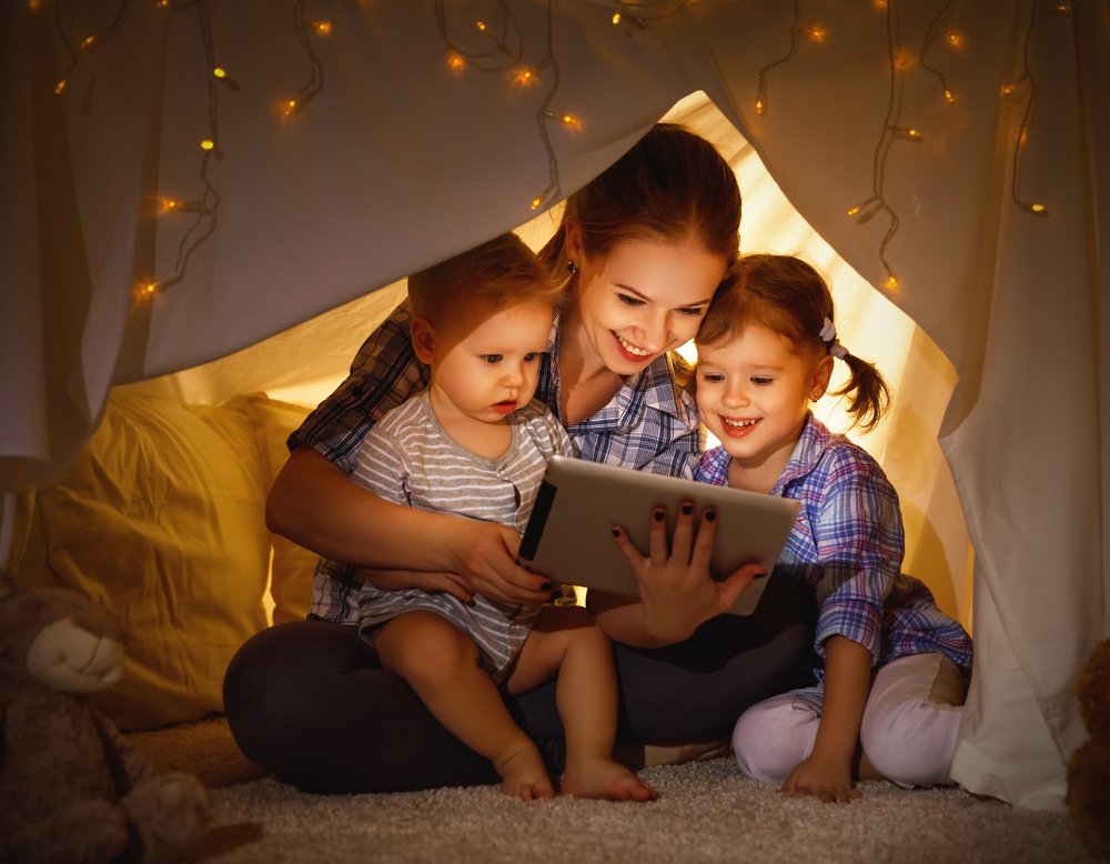 Parents and children using a tablet