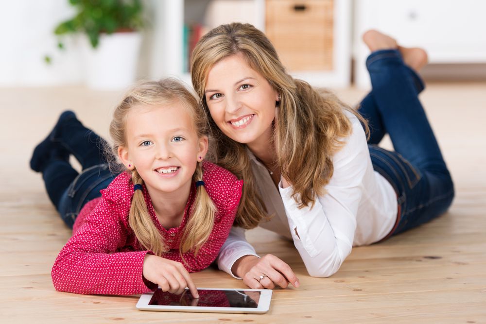 Mom and daughter using tablet