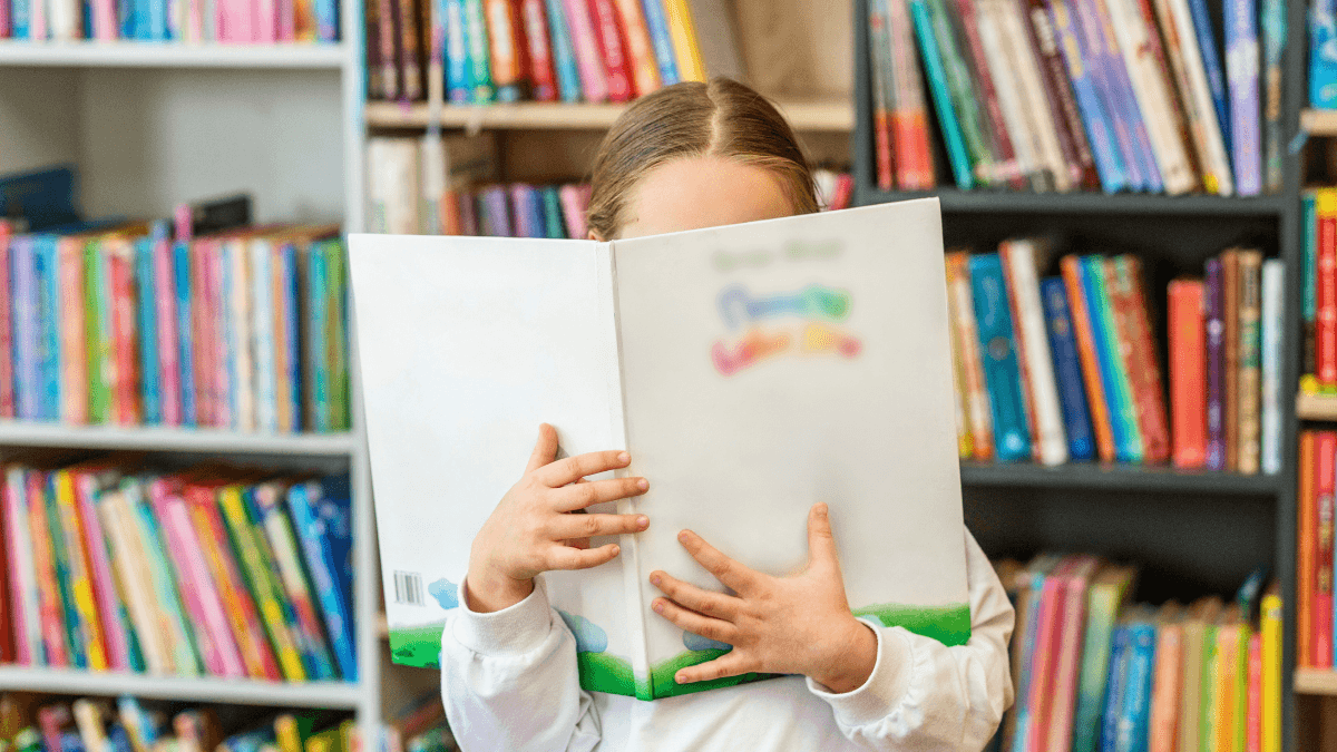 Child skips words when reading while practicing with a book