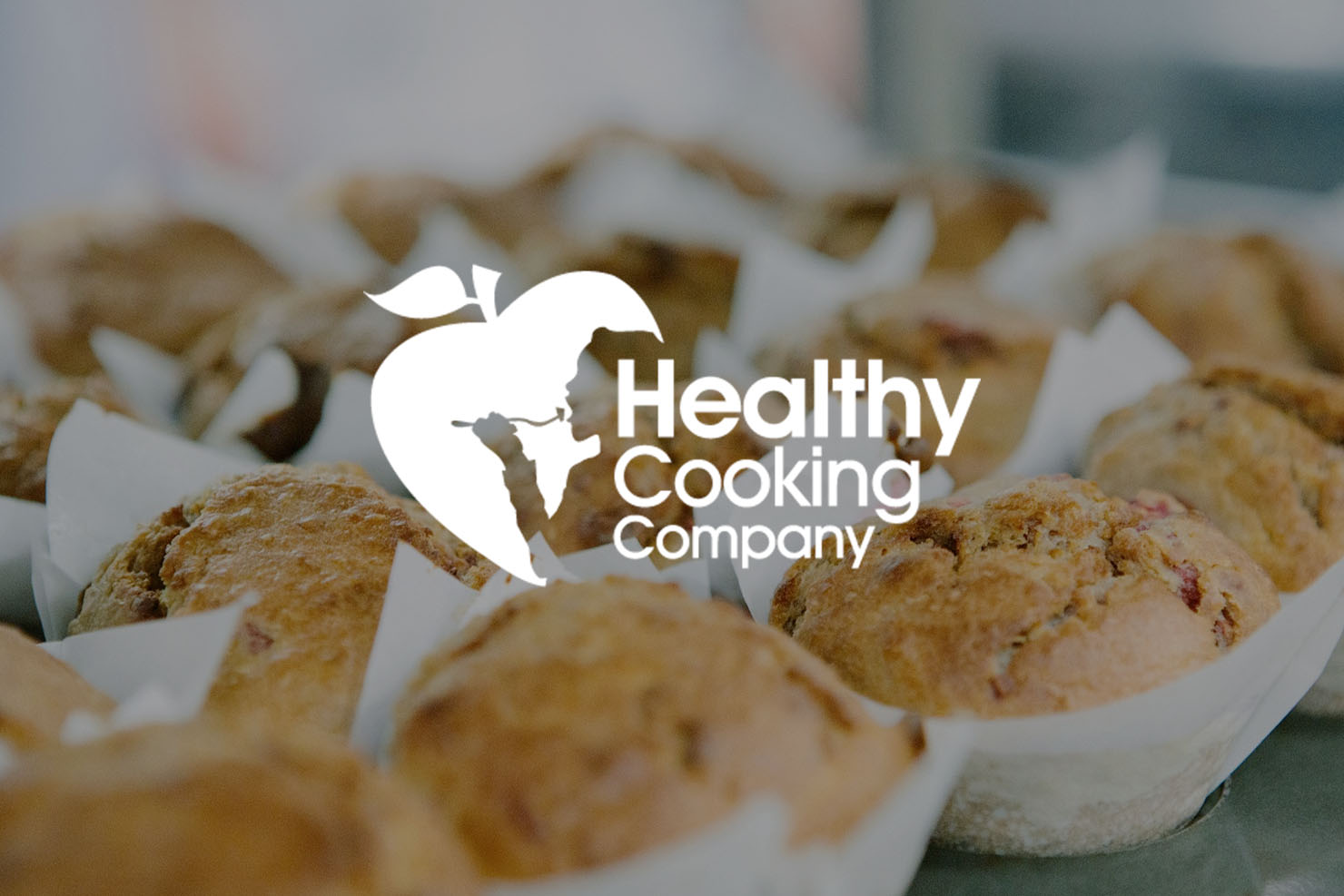 Healthy Cooking Co logo on image of muffins