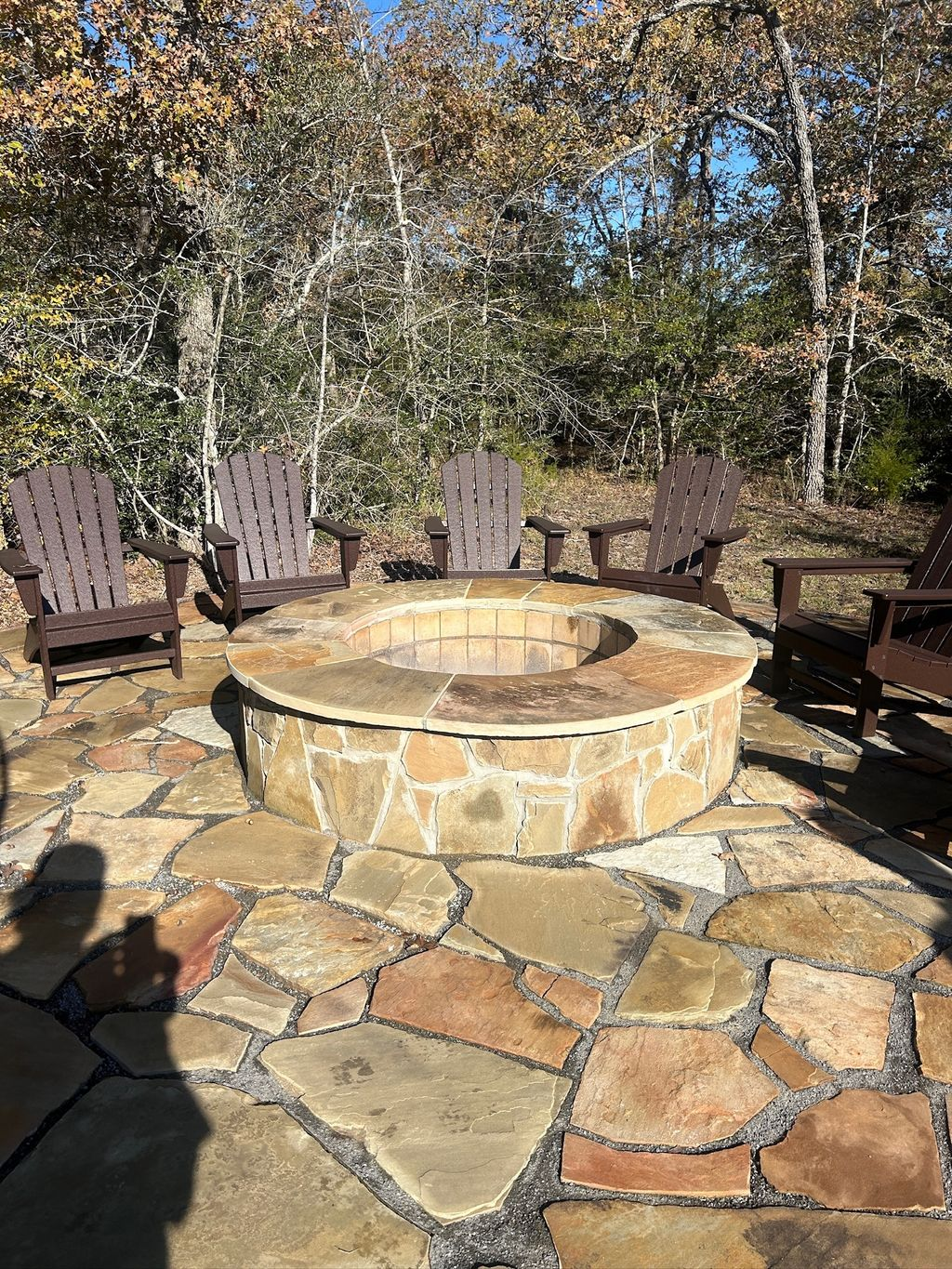 Corner view of luxury brick and stone home with new shingle roof in Southlake TX
