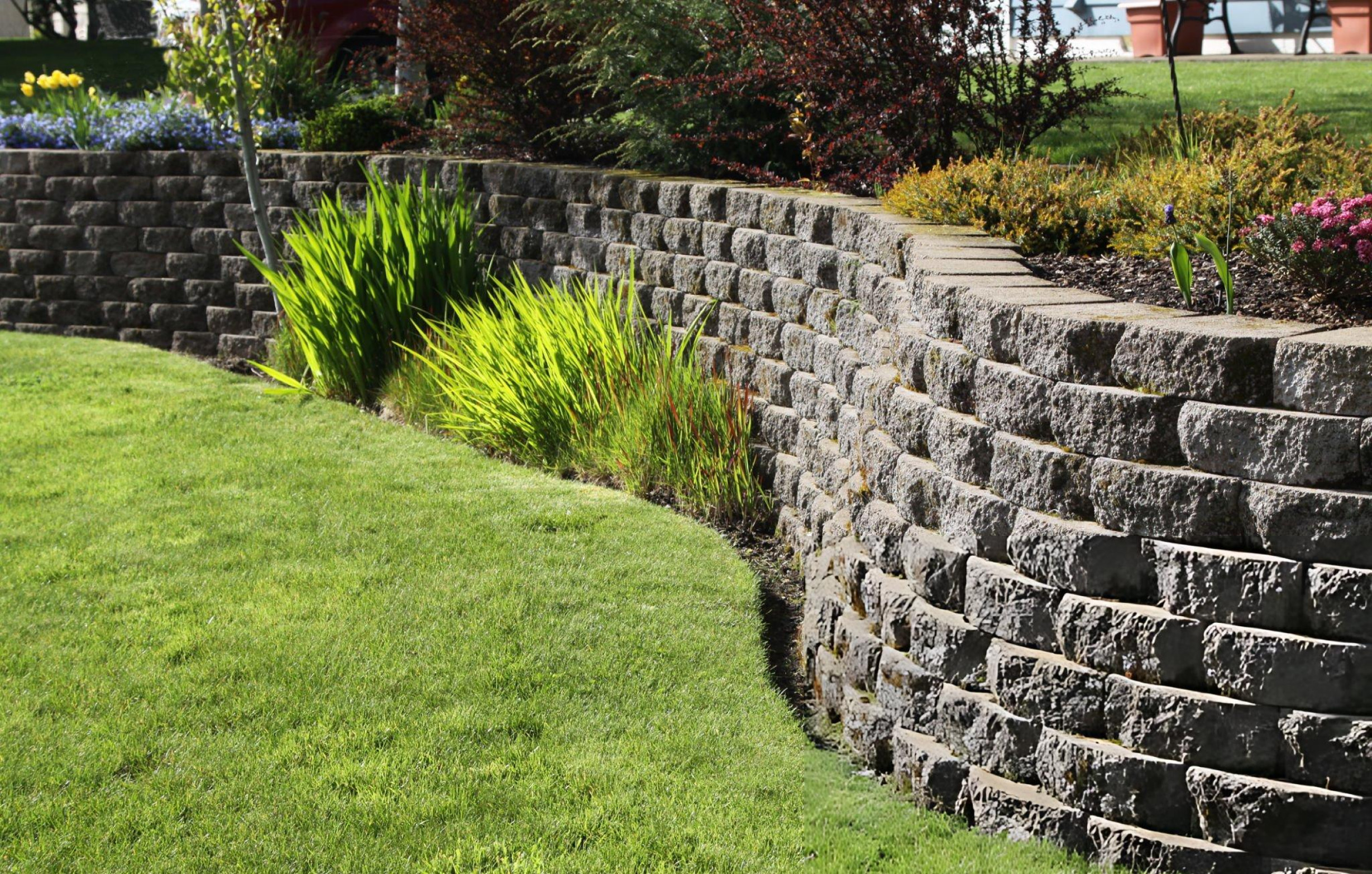 Front view of brick and stone home with landscaped yard and new shingle roof in Southlake TX