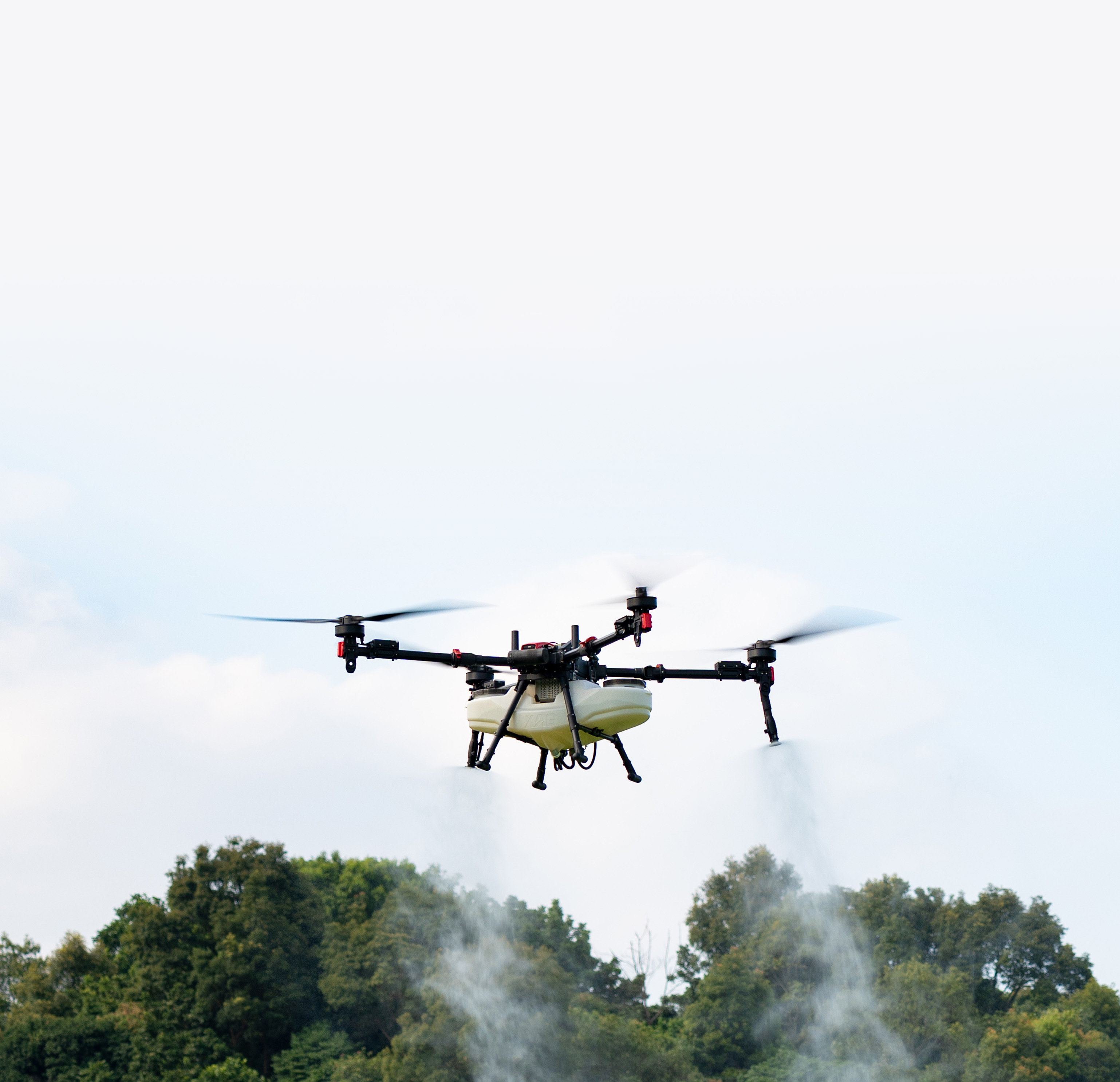 Aerial view of a suburban neighborhood with closely packed two-story houses featuring dark tiled roofs and pastel-colored exteriors.