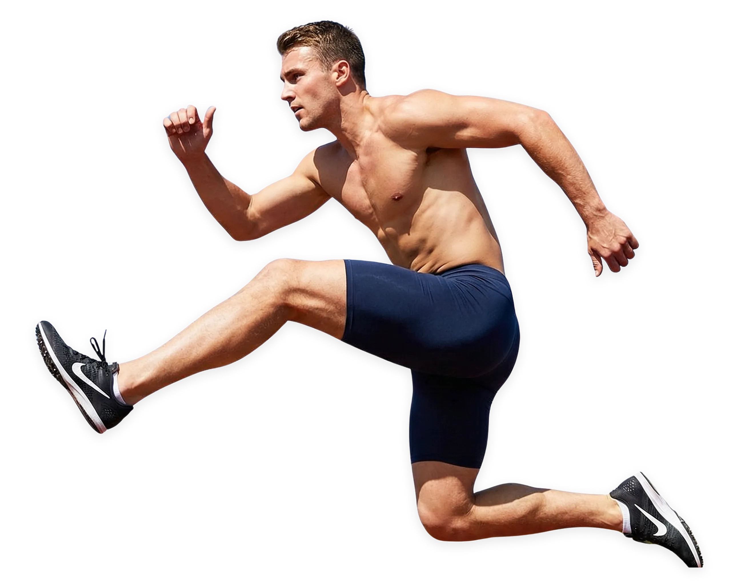 Shirtless man in navy shorts and black sneakers performing a high knee jump in mid-air.