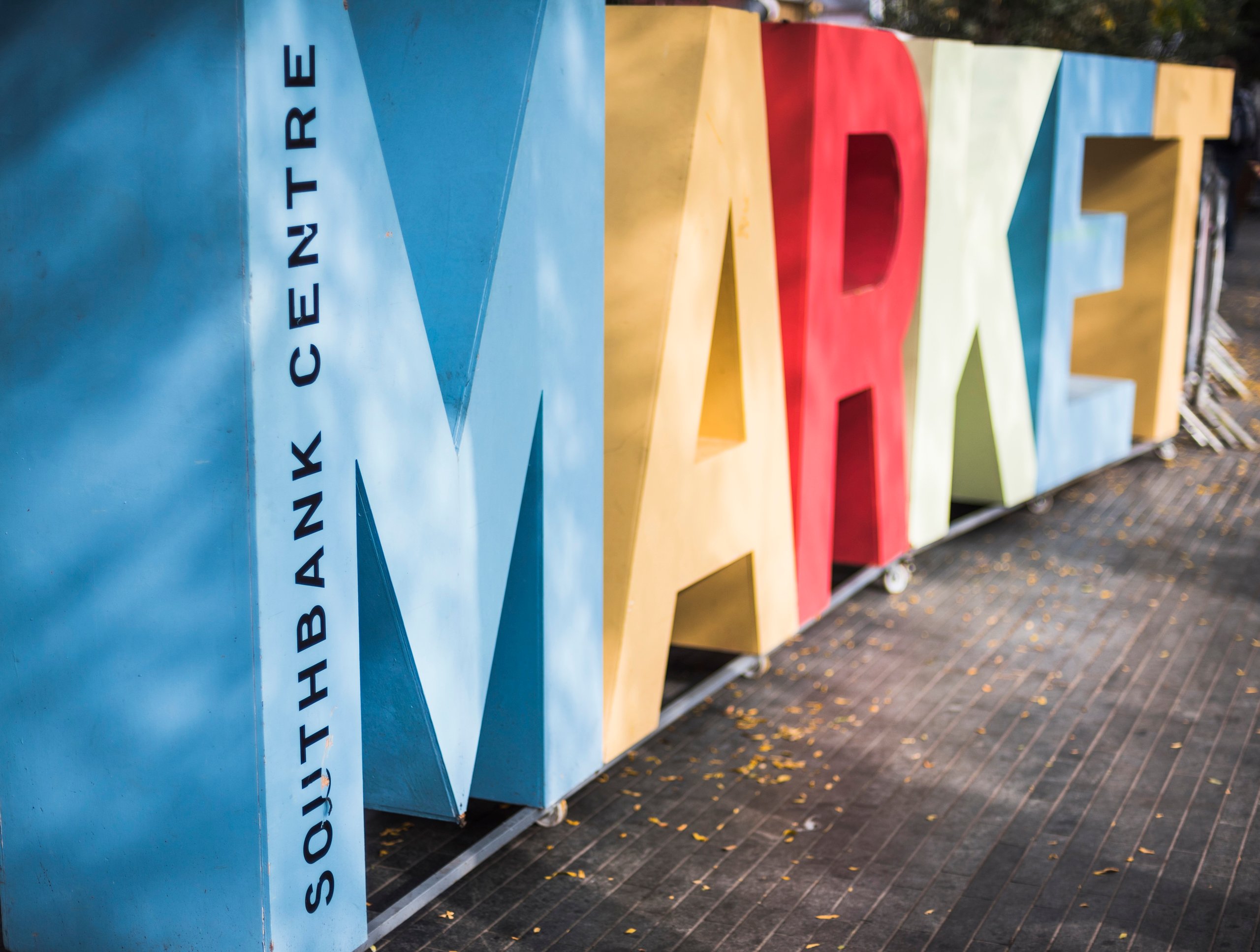 Large colorful 3D letters spelling 'MARKET' with the words 'SOUTHBANK CENTRE' written vertically on the blue M.