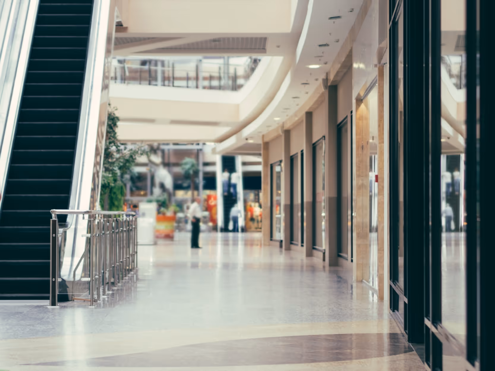 Interior of shopping mall with escalator stock image