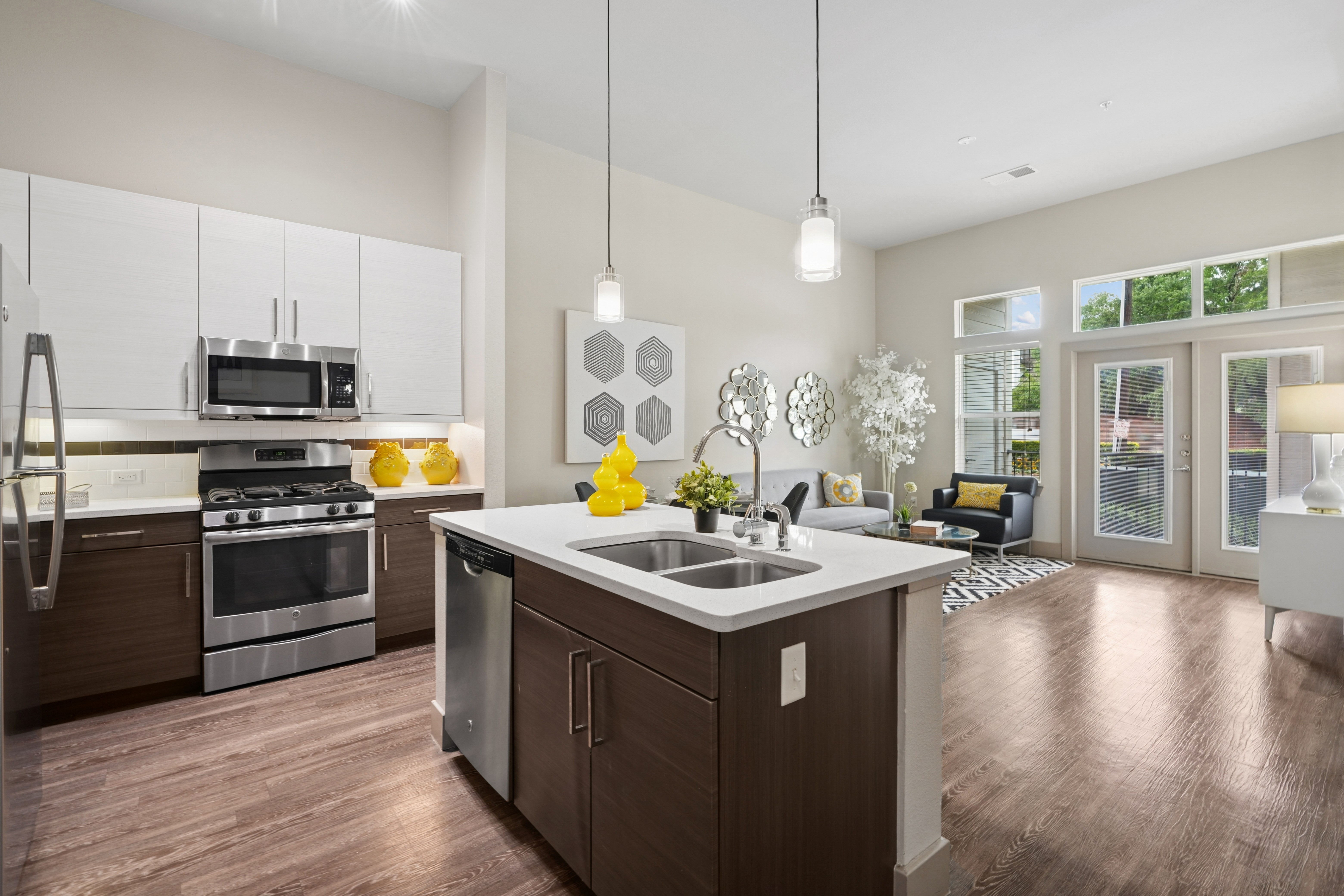 Kitchen with island, stainless steel appliances and white cabinets