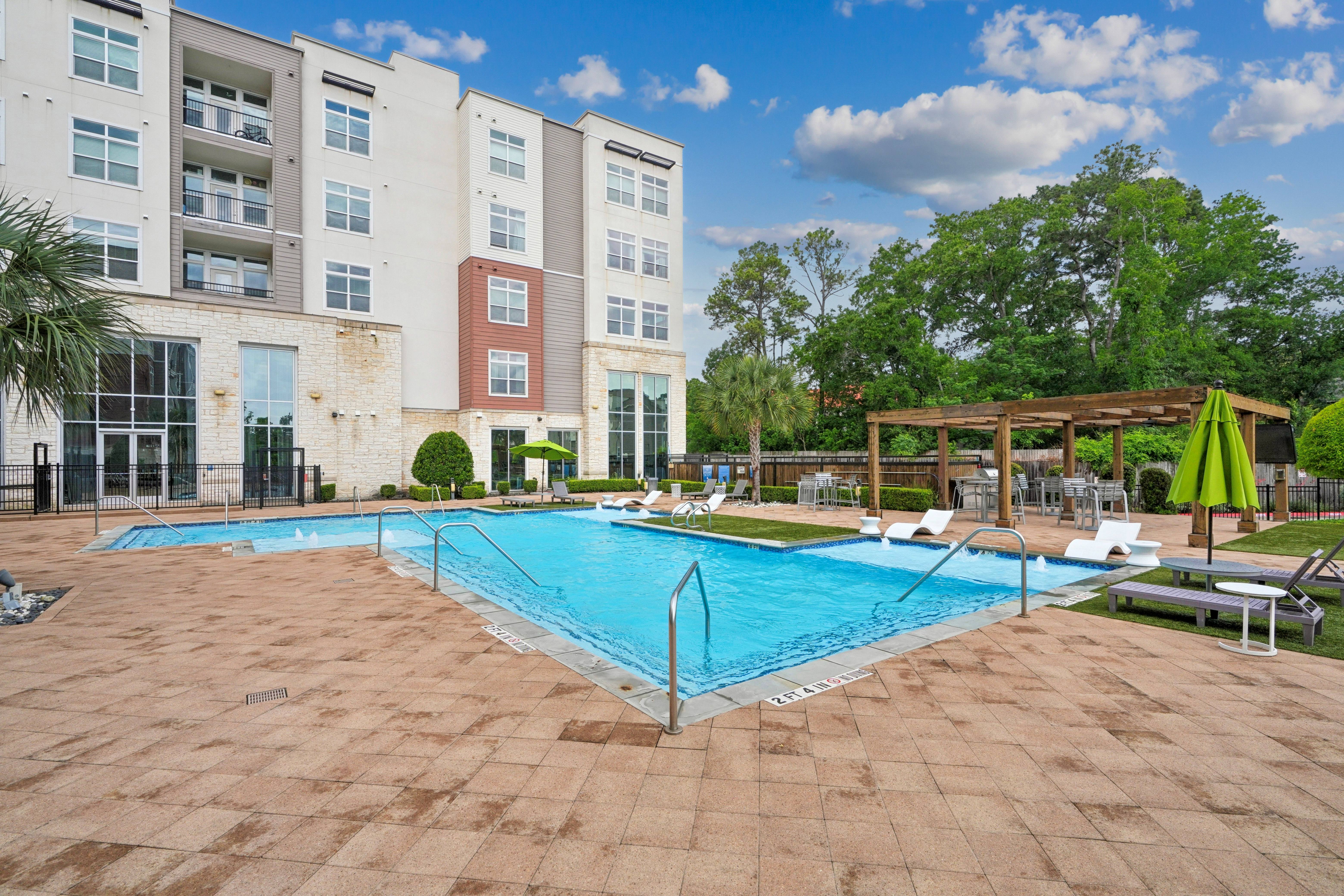 Swimming pool with exterior view of vargos in background
