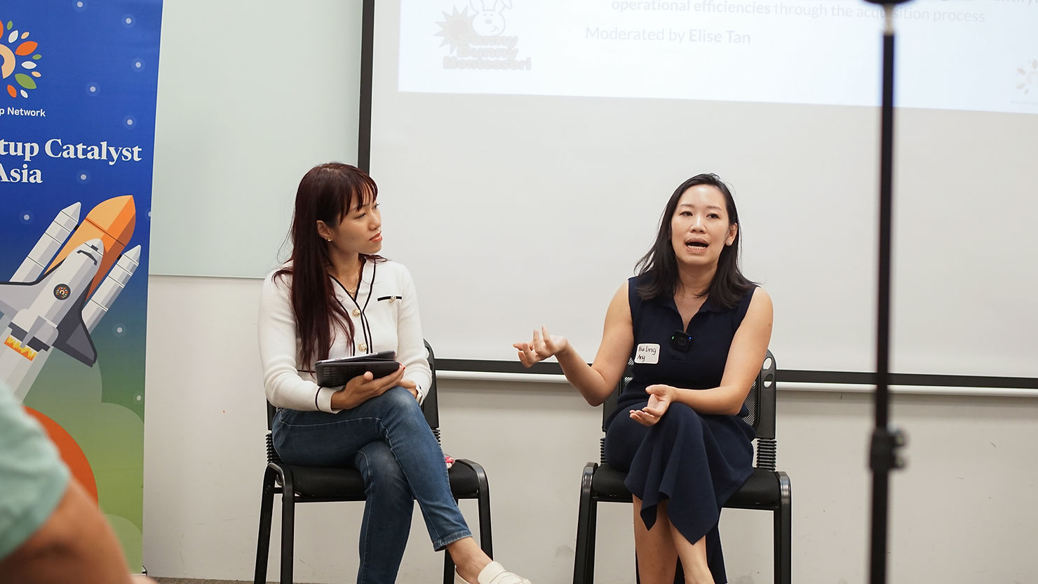 Elise having fireside chat with one of the entrepreneurs Huiling Ang